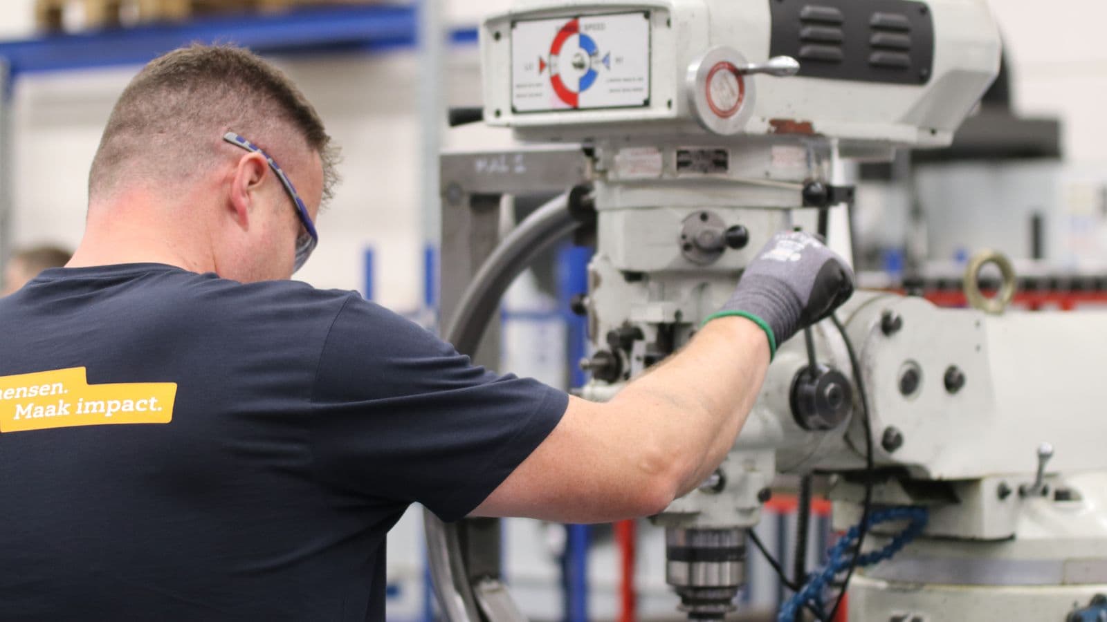 Technician working on a machine in production